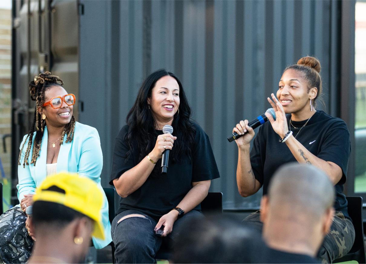 People speaking at a .SWOOSH event